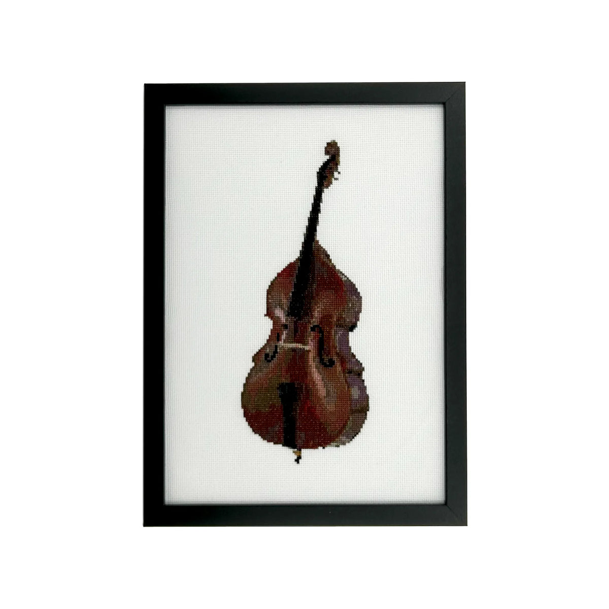 Framed cross stitch of a double bass on white fabric