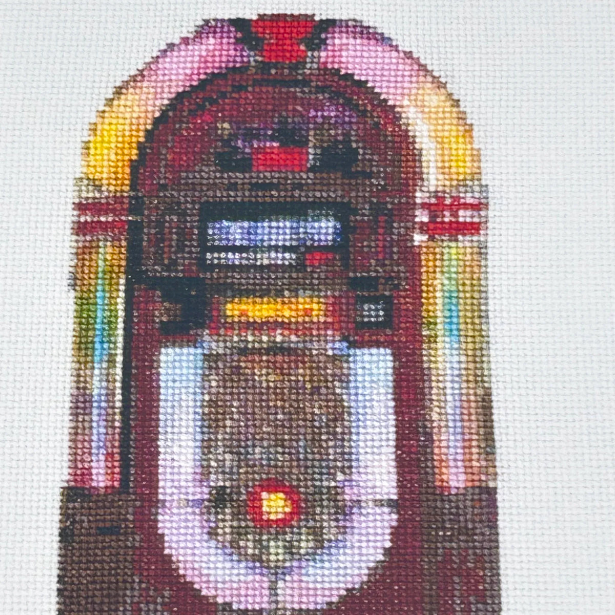 close up of the A5 art print of the original embroidery design of a retro jukebox showing realistic stitches and fabric