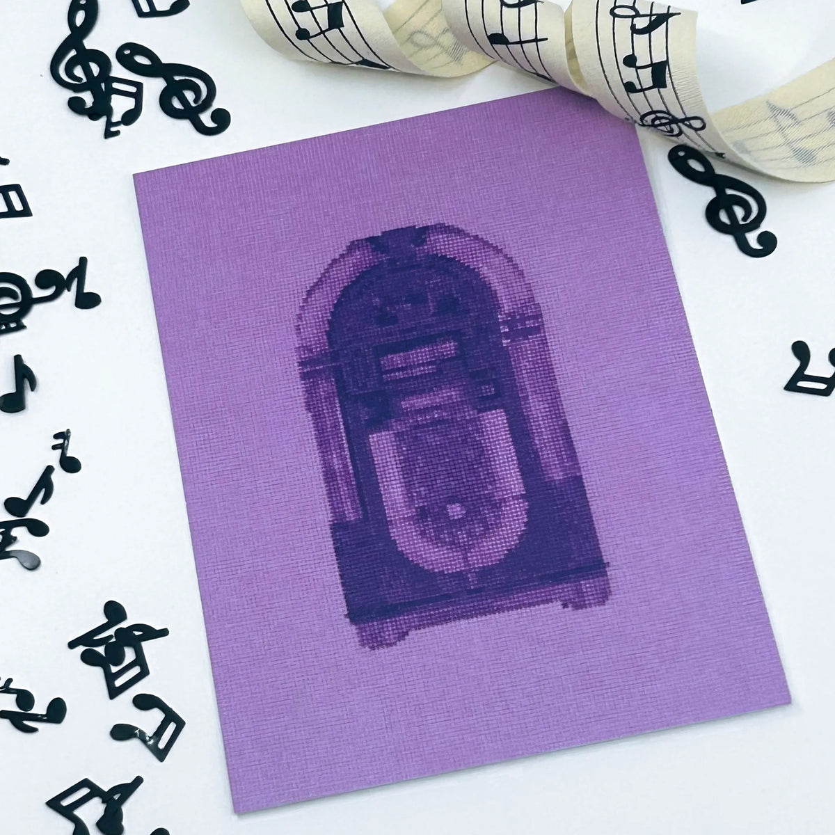 colourful postcard of the original embroidery design of a vintage jukebox