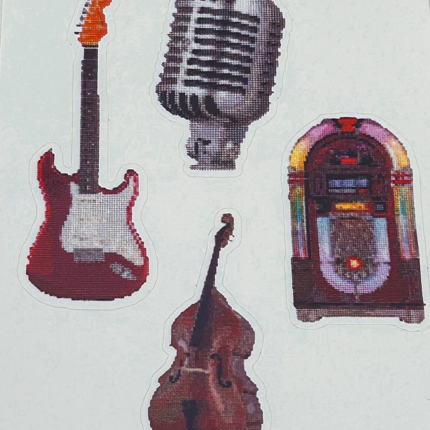 close up of stickers of the original embroidery designs of the vintage mic fender strat retro jukebox and double basst