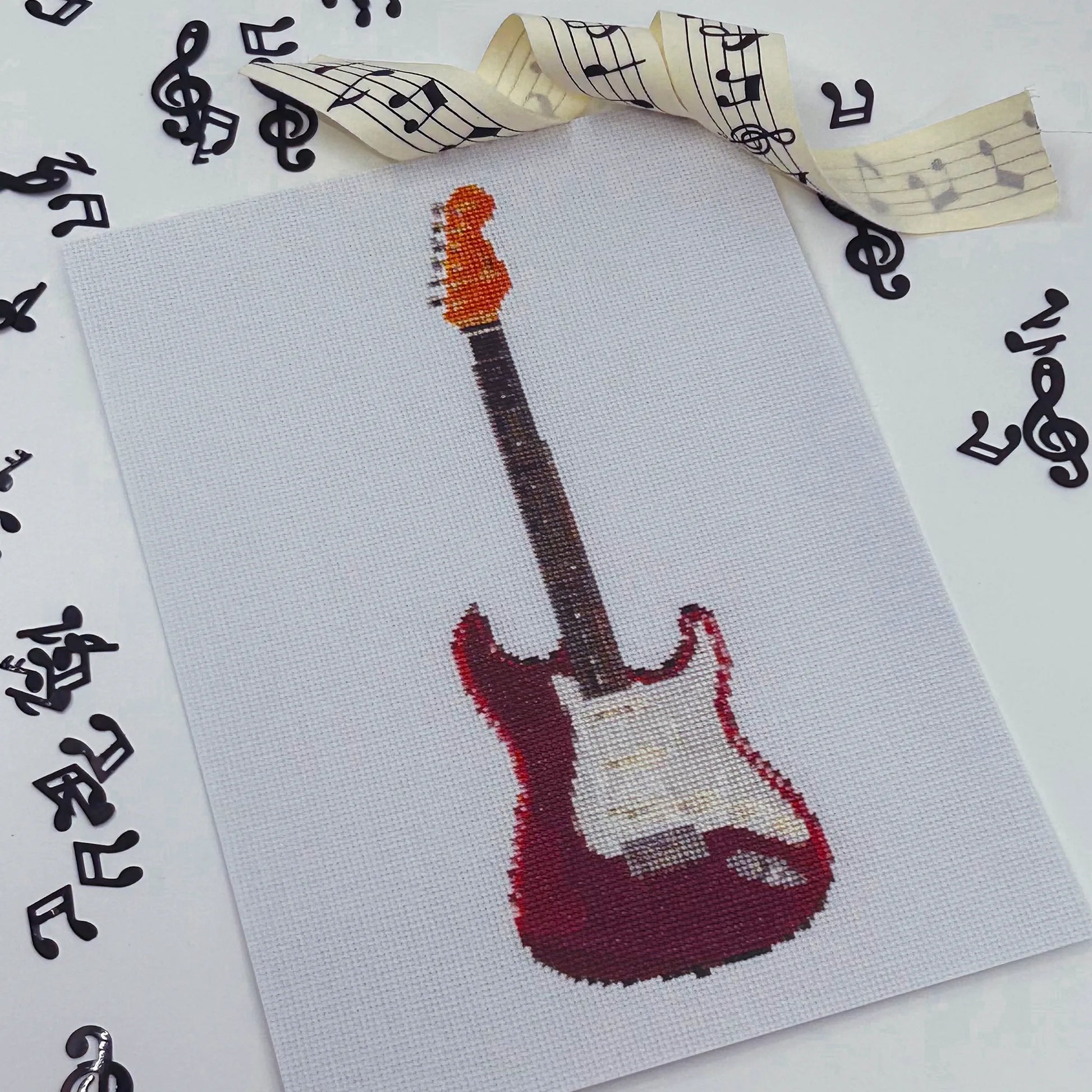 A5 print of the original embroidery artwork of a red fender strat 