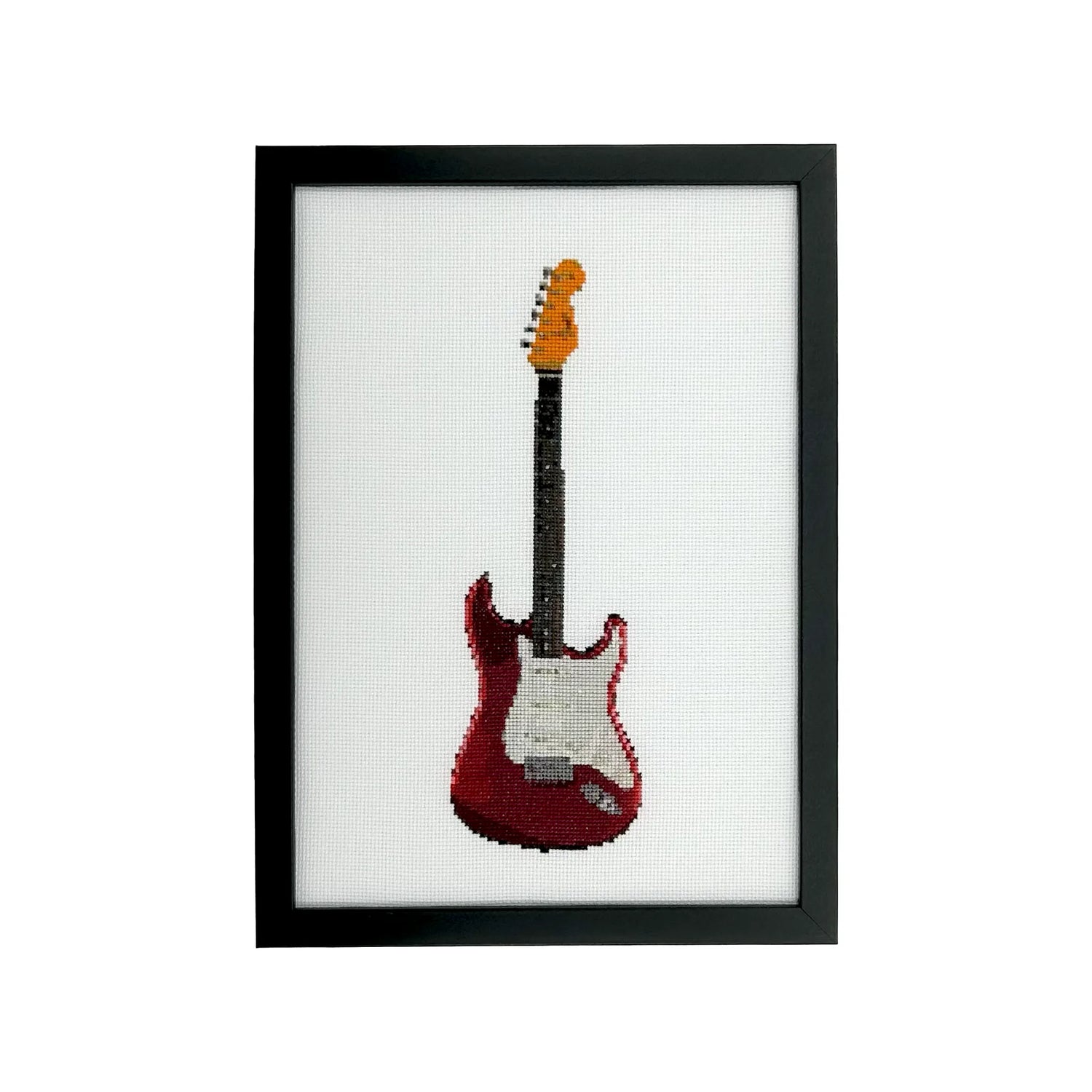Framed cross-stitched fender strat guitar on white fabric