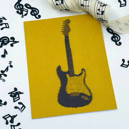 colourful postcard of the original embroidery design of a fender strat