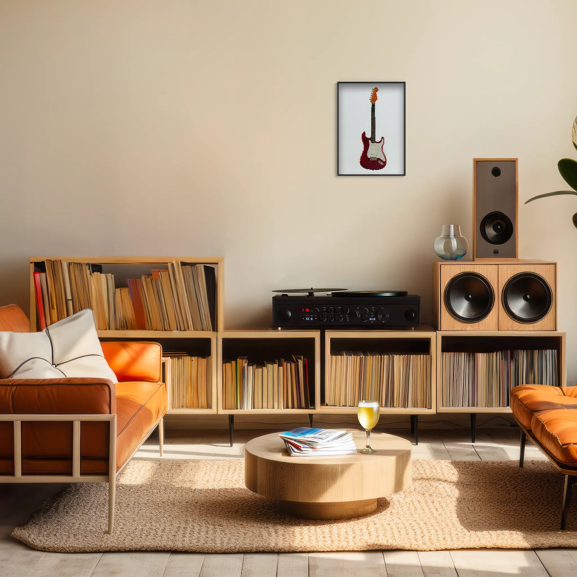 A4 print of the original embroidery design of a fender strat framed and hung up on a living room wall