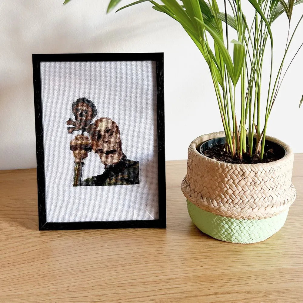 Framed robed skeleton embroidery