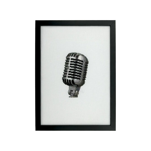 Framed artwork of a vintage microphone on a white background